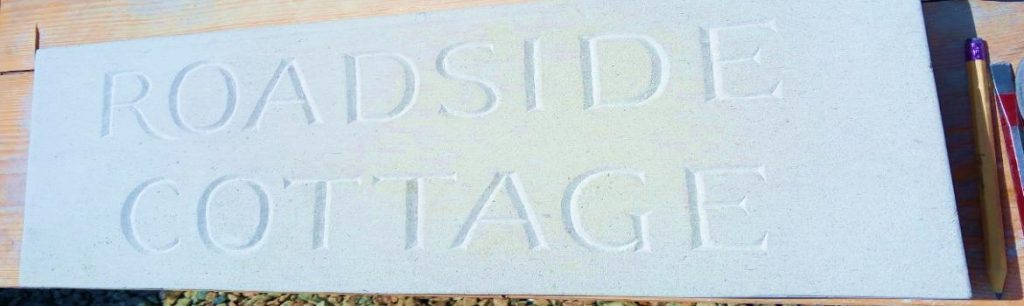 Traditionally carved house sign name Roadside Cottage in Portland stone especially for you